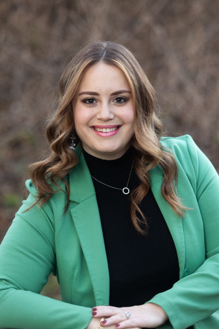 Shiffy Leifer, founder of ClareOps, in a green jacket